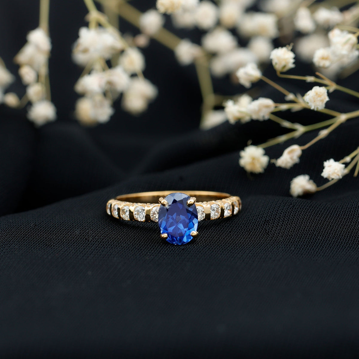 Certified 1.5 Carat oval lab-grown blue sapphire engagement ring with diamonds from Rosec Jewels, showcasing a stunning gemstone setting.