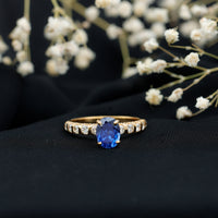 Certified 1.5 Carat oval lab-grown blue sapphire engagement ring with diamonds from Rosec Jewels, showcasing a stunning gemstone setting.