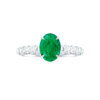 Natural 6x8mm emerald oval engagement ring with diamond side stones by Rosec Jewels, showcasing a stunning gemstone and elegant design.