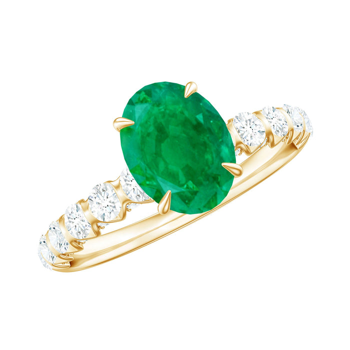 Natural 6x8mm emerald oval engagement ring with diamond side stones from Rosec Jewels, showcasing the elegant ring design.