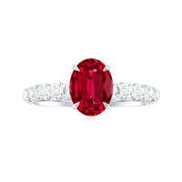 Rosec Jewels 1.5 Carat lab-grown ruby oval engagement ring with diamond accents, showcasing detailed craftsmanship and elegant design.