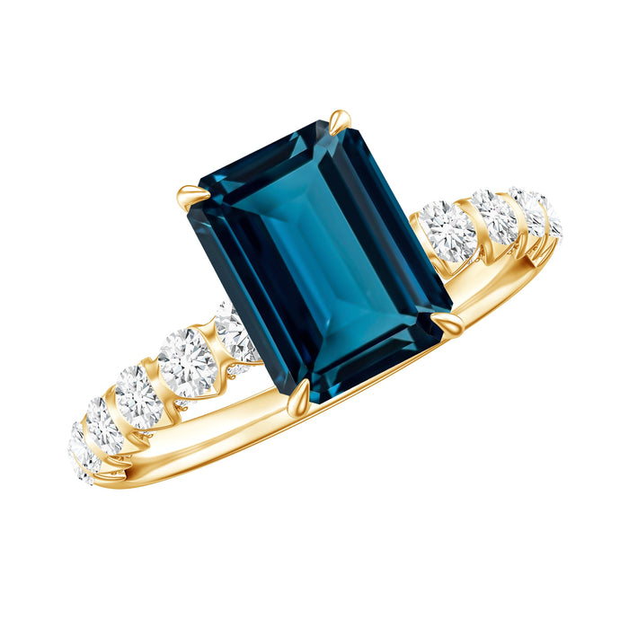 Emerald cut London Blue Topaz engagement ring with diamond side stones from Rosec Jewels, showcasing a 2.25 carat gemstone and elegant setting.