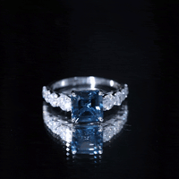 Asscher cut London Blue Topaz solitaire engagement ring with Moissanite by Rosec Jewels, showcasing the elegant blue gemstone and silver band.