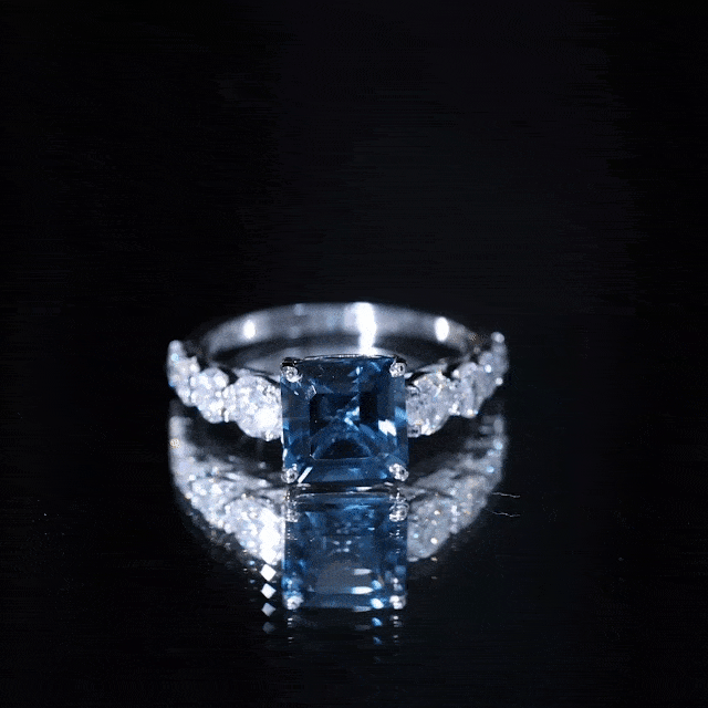 Asscher cut 3 carat London Blue Topaz solitaire engagement ring with moissanite accents, crafted by Rosec Jewels.