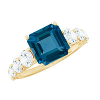 Asscher cut London Blue Topaz solitaire engagement ring with moissanite accents, showcasing a elegant design and sparkling gemstones.
