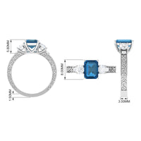 Rosec Jewels 6x8mm London Blue Topaz statement ring with emerald cut gemstone and engraved shank design.