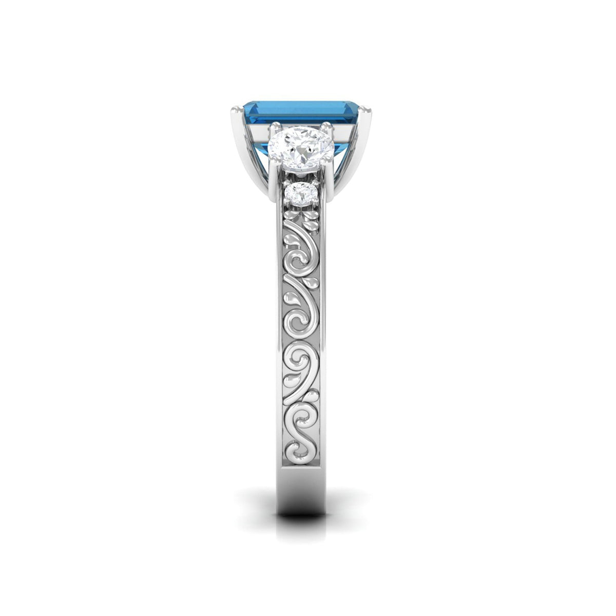 Emerald cut London Blue Topaz statement ring with engraved shank from Rosec Jewels, showcasing a striking blue gemstone and detailed band.