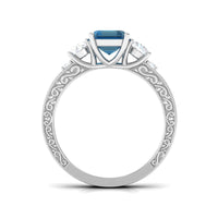 Rosec Jewels emerald cut London Blue Topaz statement ring with engraved shank, showcasing a 6x8mm gemstone on a detailed band.