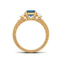 Rosec Jewels emerald cut London Blue Topaz statement ring with engraved shank, showcasing a 6x8mm blue gemstone and intricate band details.