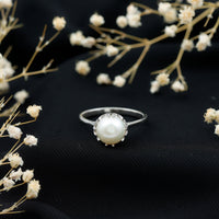 Cultured 7.4 Carat freshwater pearl solitaire engagement ring by Rosec Jewels featuring a single elegant pearl on a silver band.