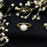 Freshwater pearl solitaire engagement ring by Rosec Jewels featuring a 7.4-carat cultured pearl on a sleek ring band.