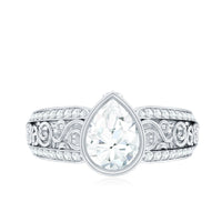 Bezel Set Moissanite Pear Engagement Ring with Filigree Details