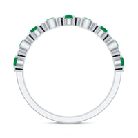 Natural green emerald half eternity ring by Rosec Jewels, featuring a stackable design with vivid emerald gemstones set in a sleek ring.