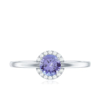 Natural Tanzanite engagement ring with diamond halo by Rosec Jewels, showcasing a central tanzanite stone surrounded by sparkling diamonds.