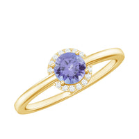 Natural Tanzanite engagement ring with diamond halo featuring a central violet-blue Tanzanite stone and sparkling diamond accents.