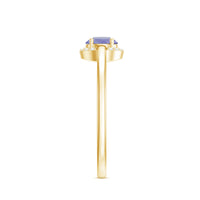 Natural Tanzanite engagement ring with diamond halo featuring a central tanzanite gemstone surrounded by sparkling diamonds.