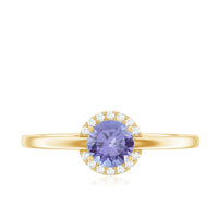 Natural Tanzanite engagement ring with diamond halo set in a rose gold band, showcasing elegant gemstone and sparkling accent diamonds.
