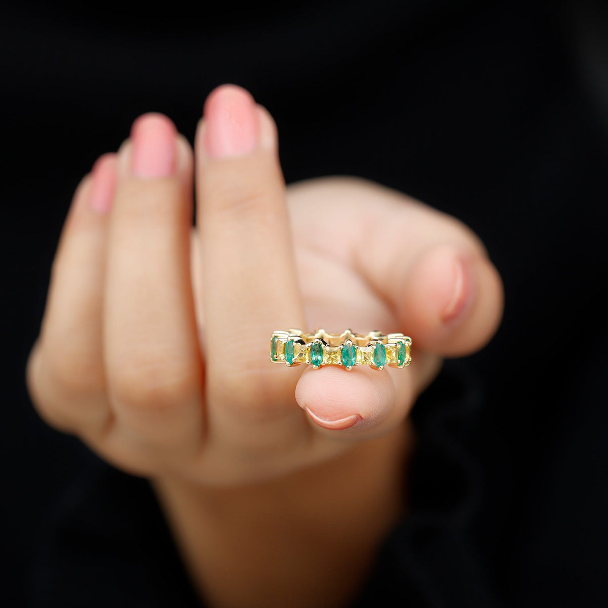 Designer yellow sapphire and emerald eternity wedding band by Rosec Jewels, featuring alternating gemstone accents on a gold ring.