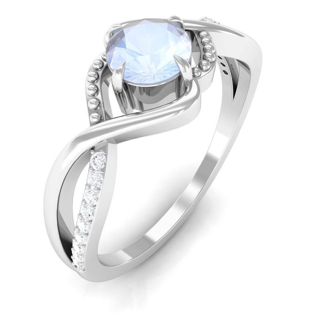 Rosec Jewels 1/2 CT moonstone solitaire crossover ring with diamond accents, showcasing elegant claw setting and unique design.