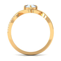 Rosec Jewels moonstone solitaire crossover ring with 1/2 CT claw set moonstone and diamond accents, delicate and elegant jewelry.