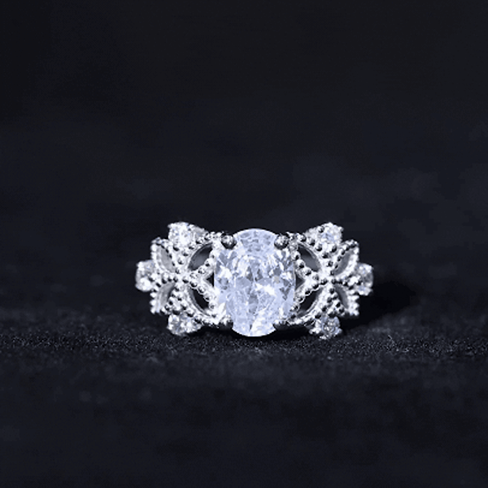 Yellow gold 6x8mm oval lab-grown diamond flower engagement ring by Rosec Jewels, showcasing intricate floral design and sparkling stones.