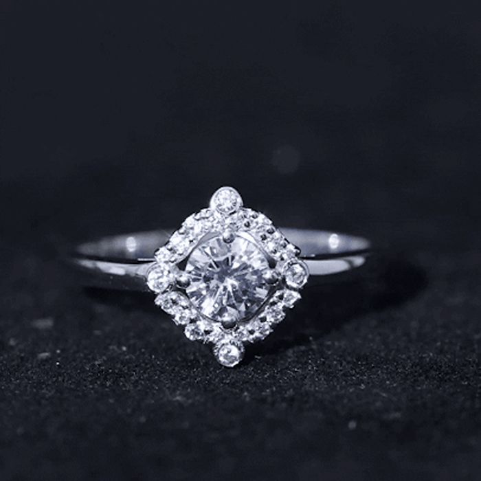 Yellow gold engagement ring with a certified 5mm lab-grown diamond from Rosec Jewels, showcasing a unique design and sparkling center stone.