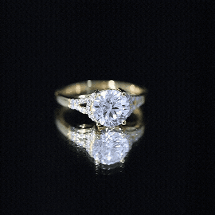 Yellow gold lab-grown diamond solitaire engagement ring with a 2-carat diamond for her, featuring a sleek, elegant design.
