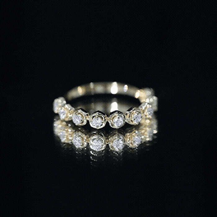 Yellow gold lab grown diamond half eternity ring from Rosec Jewels, featuring a row of sparkling diamonds around the band.