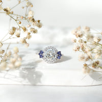 3 carat lab grown diamond halo engagement ring with blue sapphire accents, featuring a rose gold band from Rosec Jewels.