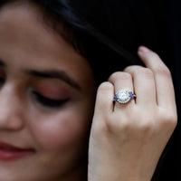 Rosec Jewels 3 Carat lab-grown diamond halo engagement ring with blue sapphire, featuring intricate design and sparkling stones.
