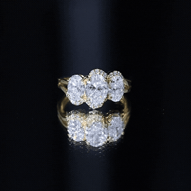 Yellow gold three-stone engagement ring featuring oval lab-grown diamonds set in a Rosec Jewels ring design.