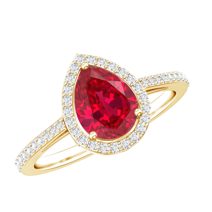 Pear-shaped lab-grown ruby engagement ring with diamond halo, featuring a teardrop design and elegant craftsmanship by Rosec Jewels.