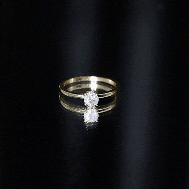 Yellow gold claw set solitaire moissanite promise ring for women by Rosec Jewels, showcasing a sparkling central stone.
