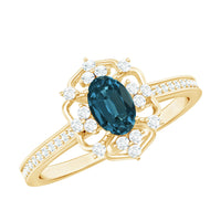 Oval cut London Blue Topaz vintage engagement ring with diamond accents, crafted by Rosec Jewels.