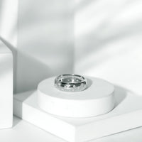 Wide band ring with scatter moissanite stones, showcasing a sparkling wedding ring design by Rosec Jewels.