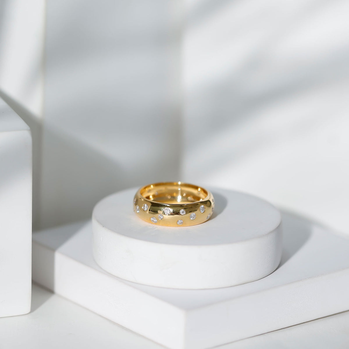 Wide band ring with scatter moissanite stones, rose gold finish, elegant wedding jewelry by Rosec Jewels.