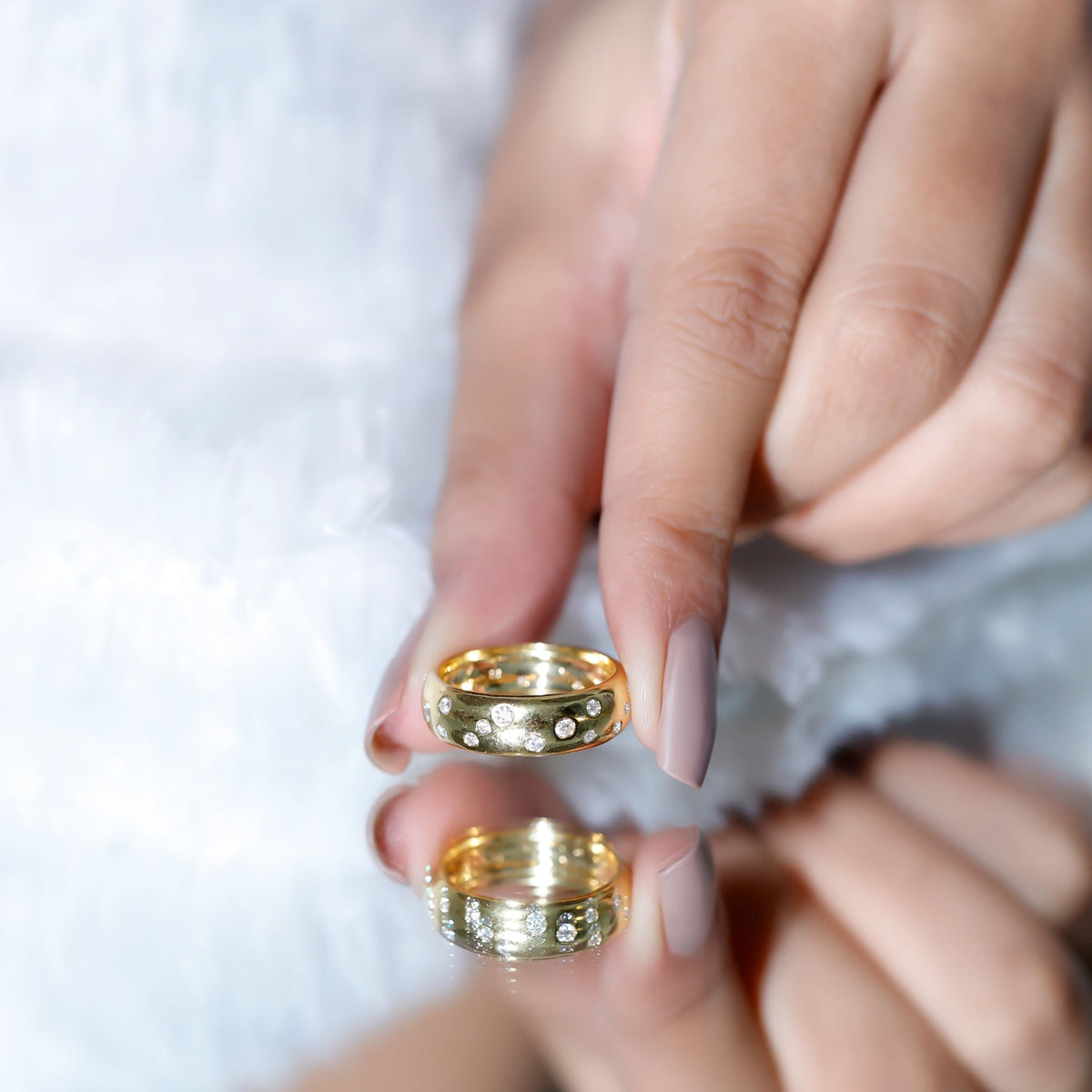 Wide band ring by Rosec Jewels featuring sparkling scatter moissanite stones in a wedding ring style.