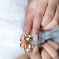Wide band ring by Rosec Jewels featuring sparkling scatter moissanite stones in a wedding ring style.