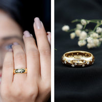 Rosec Jewels scatter moissanite wide band ring with sparkling gemstones on a sleek silver band.