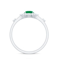 Rosec Jewels 5mm round emerald promise ring with diamond halo, showcasing a sparkling green gemstone and elegant design.