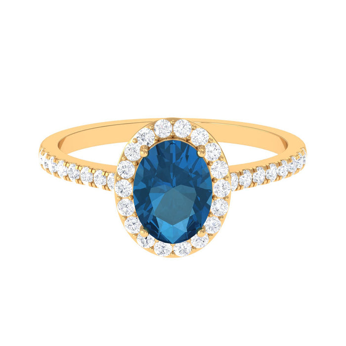 Oval cut London Blue Topaz solitaire ring with diamond halo, set in a elegant jewelry ring by Rosec Jewels.