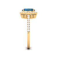 Oval cut London Blue Topaz solitaire ring with diamond halo, showcasing a silver band and elegant gemstone setting.