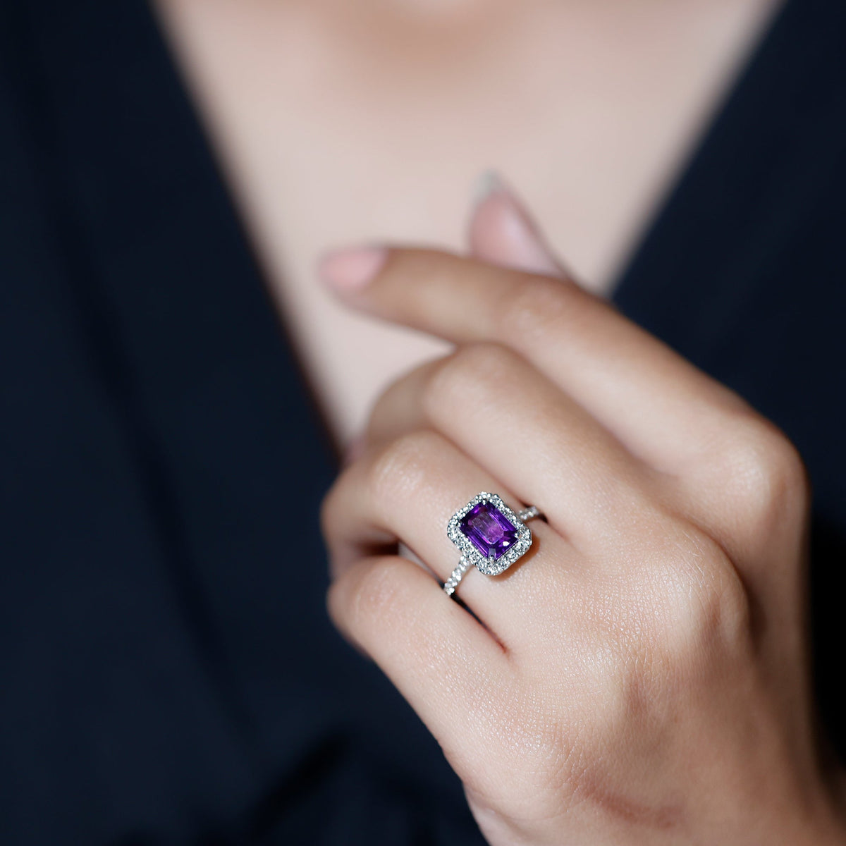 Emerald cut 1.4 carat amethyst engagement ring with diamond halo from Rosec Jewels, showcasing the vibrant purple gemstone and sparkling accents.