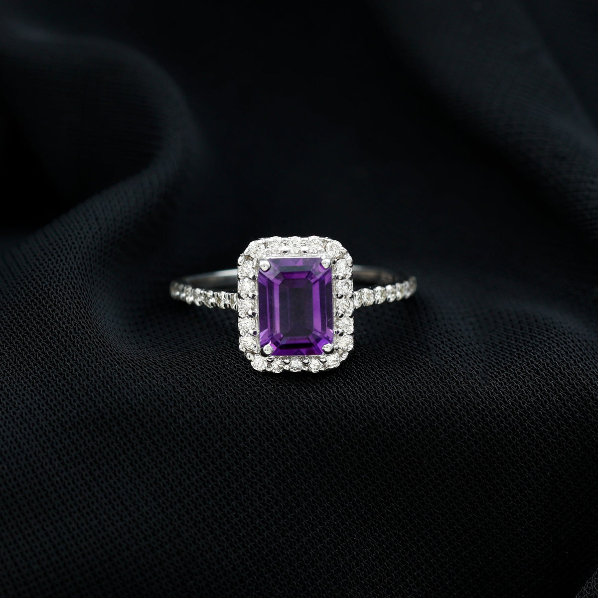 Amethyst emerald cut engagement ring with diamond halo from Rosec Jewels, featuring a 1.4 carat purple gemstone and sparkling accents