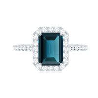 6X8mm Emerald Cut London Blue Topaz Engagement Ring with Diamond Halo