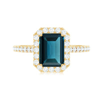 6X8mm Emerald Cut London Blue Topaz Engagement Ring with Diamond Halo