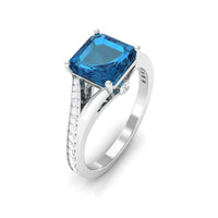 Asscher cut London Blue Topaz engagement ring with split shank and diamonds by Rosec Jewels, showcasing the elegant gemstone setting.