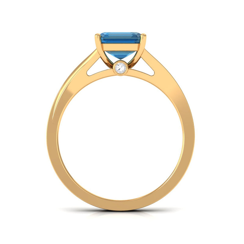 8mm Asscher cut London Blue Topaz engagement ring with split shank design and diamond accents by Rosec Jewels.