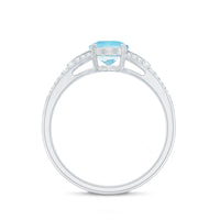 Genuine 1 Carat Oval Aquamarine Engagement Ring with Diamond Split Shank by Rosec Jewels, featuring a central aquamarine gemstone.