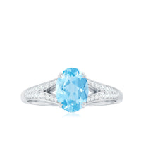 Genuine 1 Carat oval aquamarine engagement ring with diamond split shank by Rosec Jewels, featuring a detailed close-up of the ring.